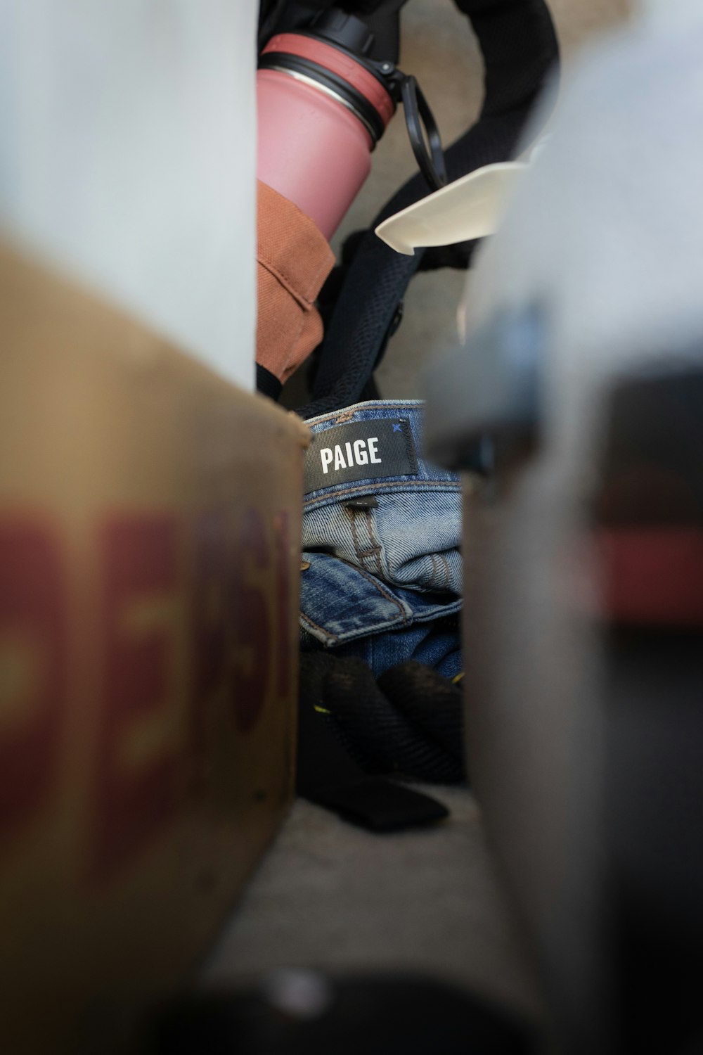 blue denim jeans on white plastic chair