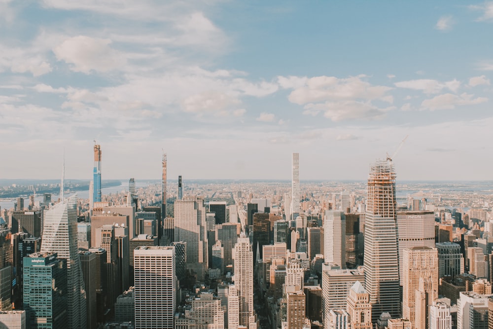 city buildings under blue sky during daytime