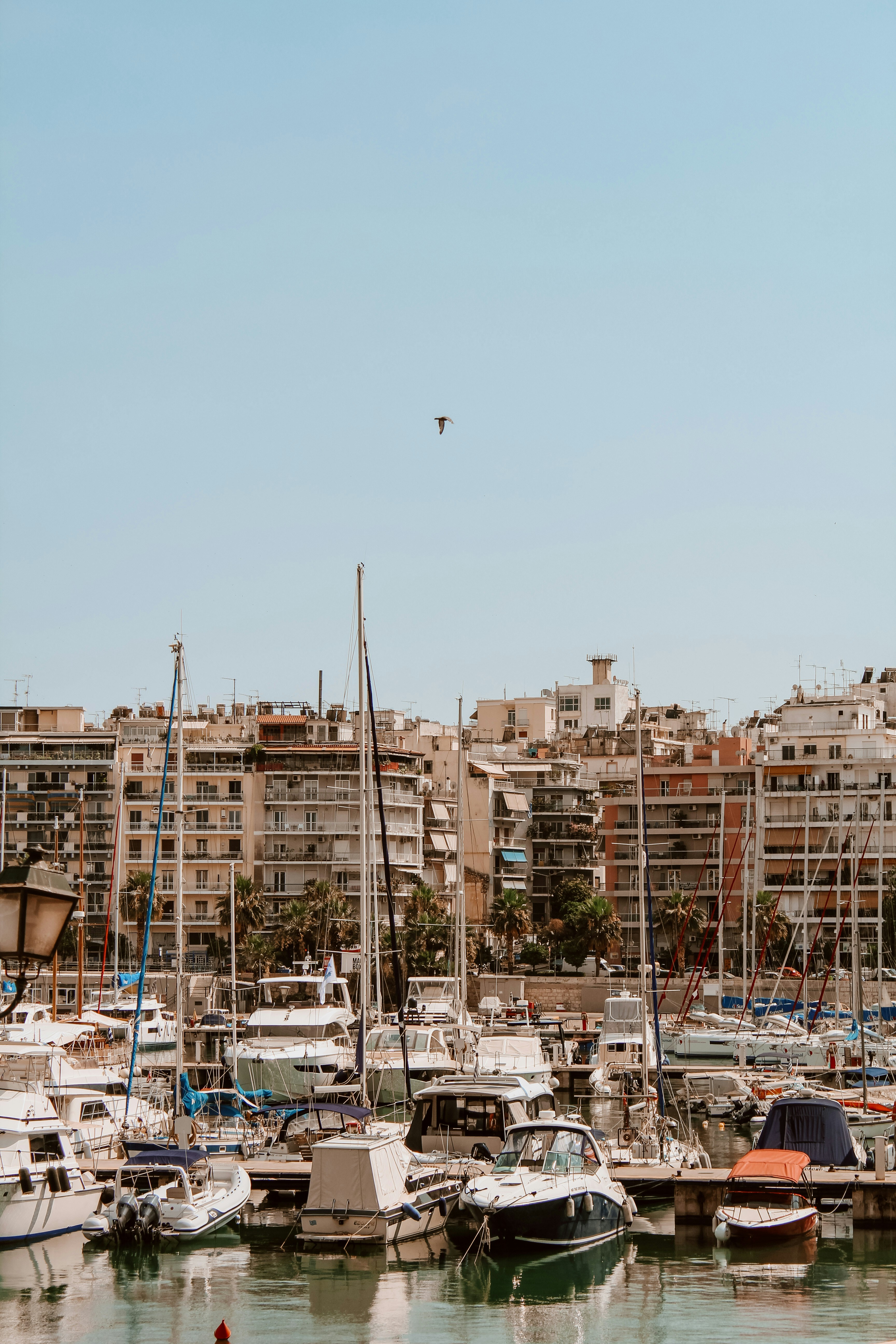 white and brown concrete building near body of water during daytime