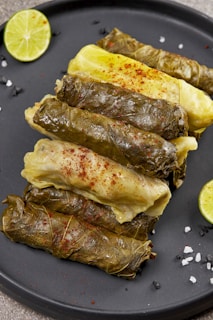 Traditional Iraqi dolma stuffed with rice and herbs on a rustic plate