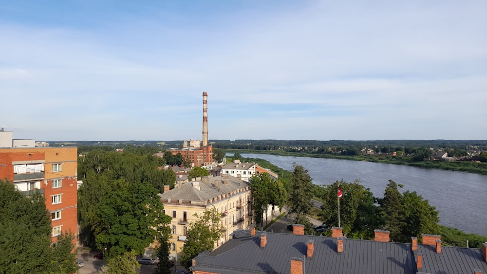 aerial view of city buildings near body of water during daytime