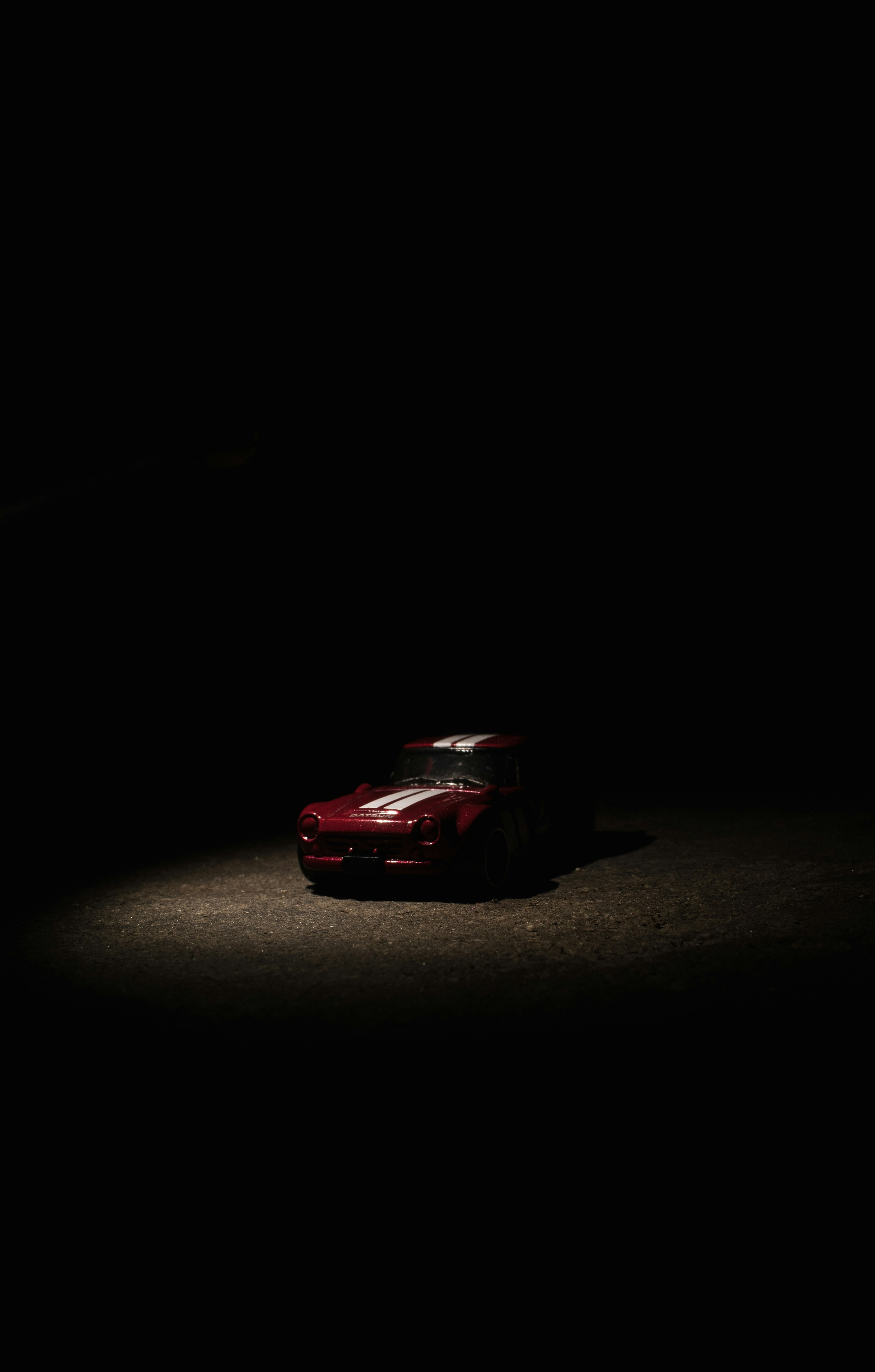 red ferrari 458 italia on dark room