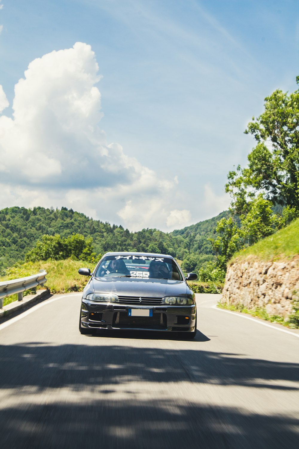 black car on road during daytime