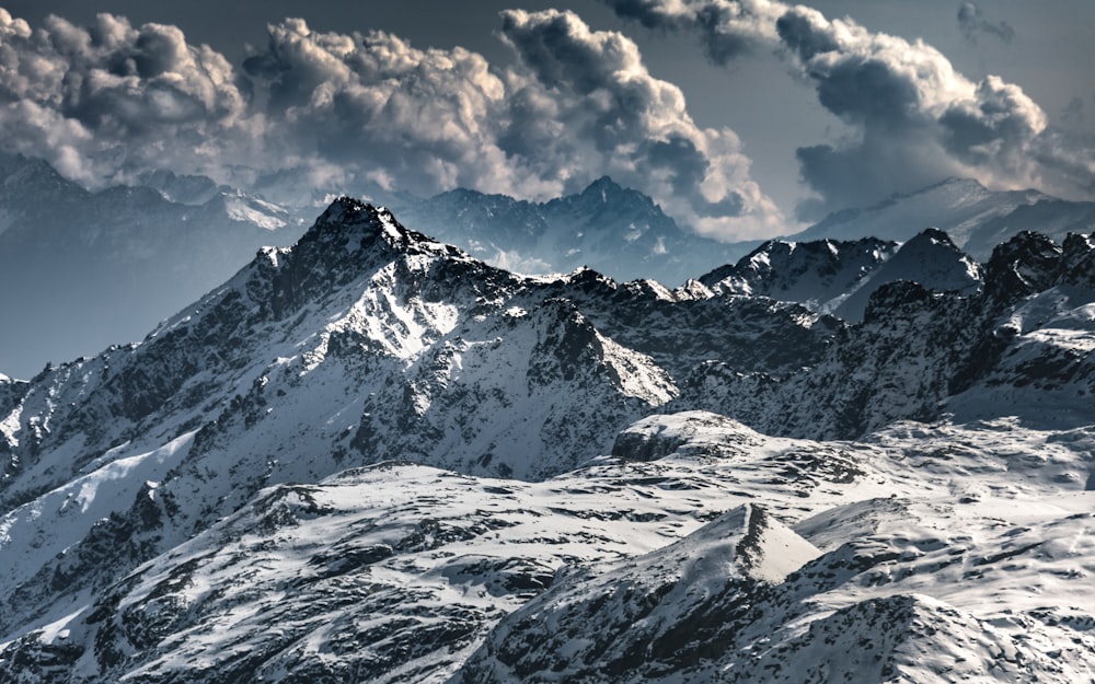 snow covered mountain under blue sky during daytime