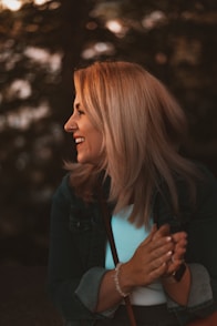 woman in black jacket smiling