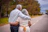 couple kissing on the road during daytime