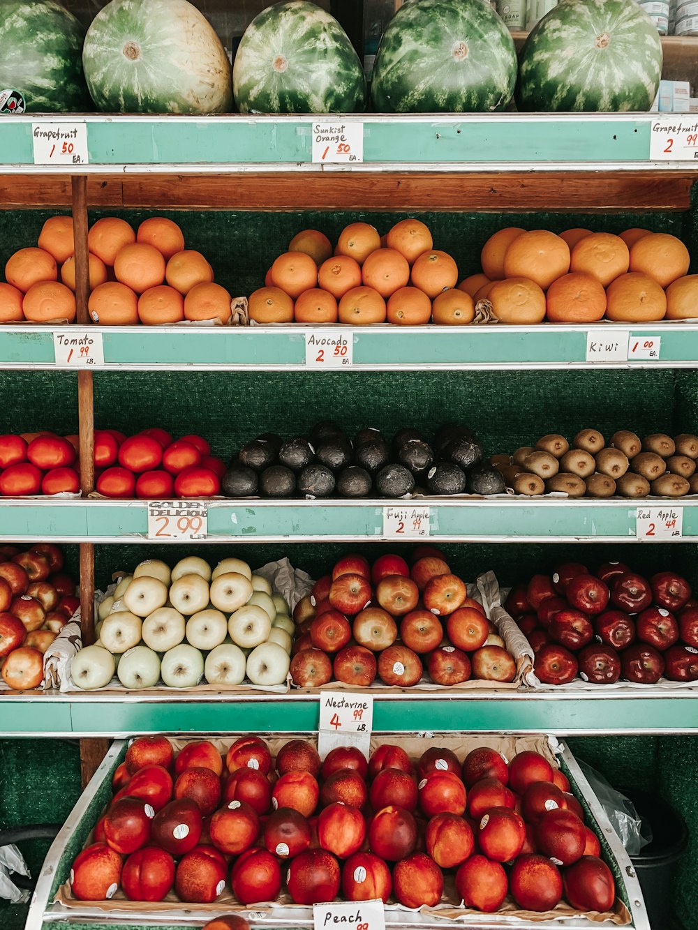 orange fruits on white plastic crate