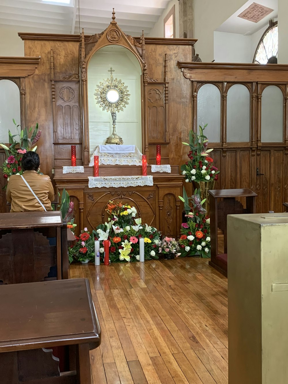 brown wooden table with red flowers on top