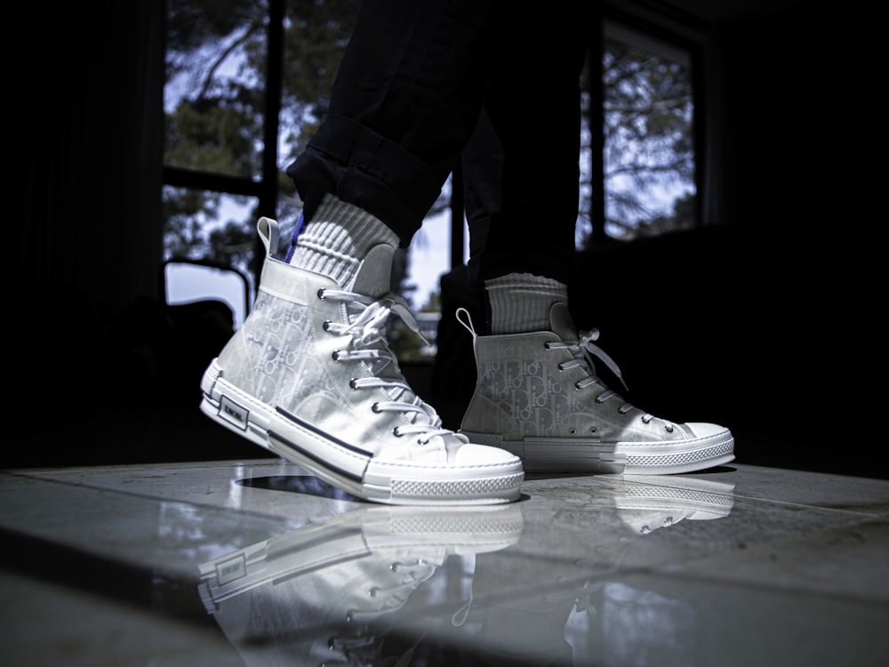 person in white nike air force 1 high
