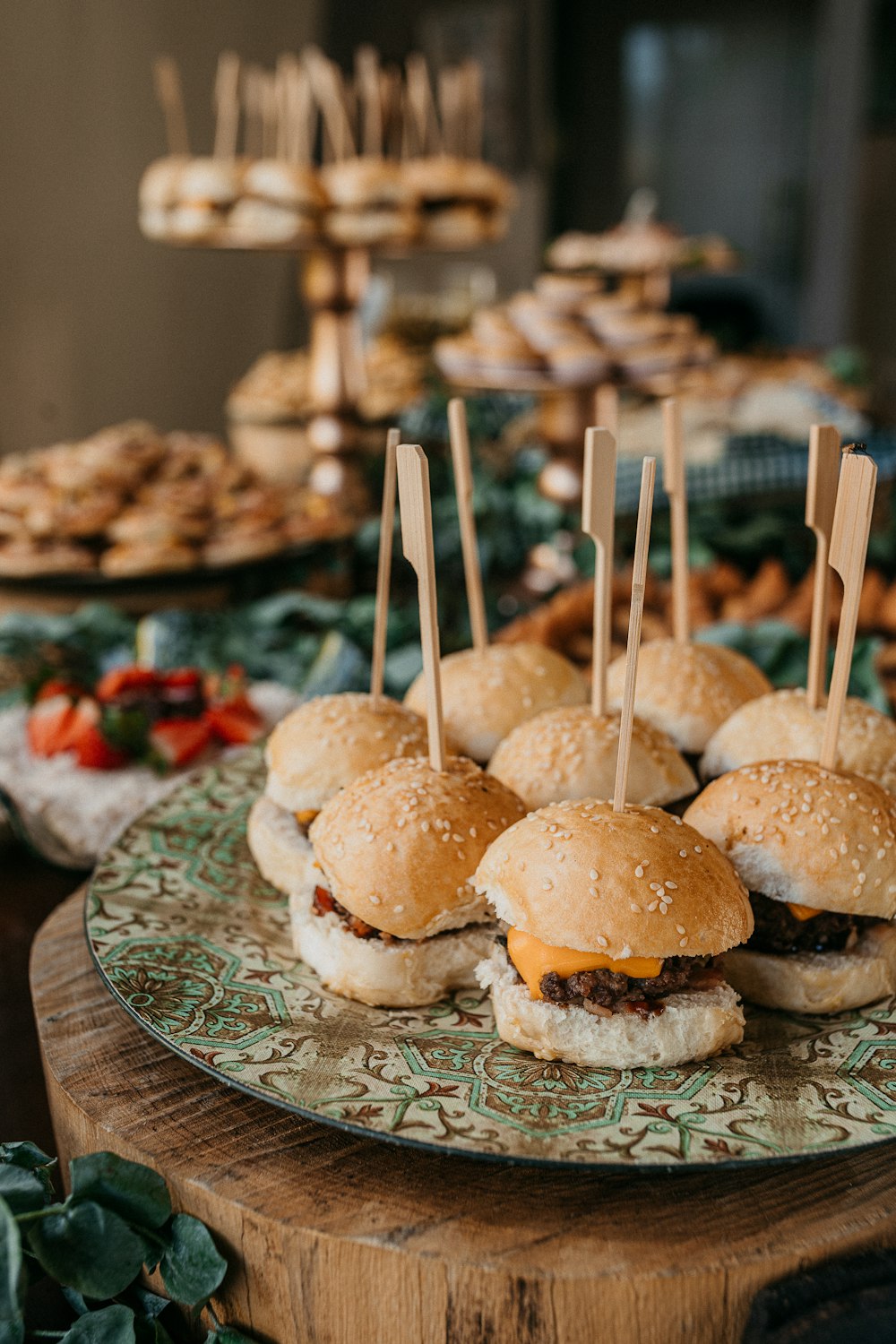 burger on white and green floral ceramic plate