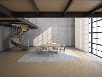 white wooden table and chairs on brown wooden floor
