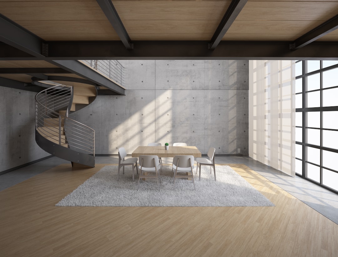 white wooden table and chairs on brown wooden floor,