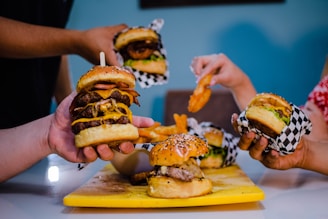 burger with patty and cheese on yellow plate