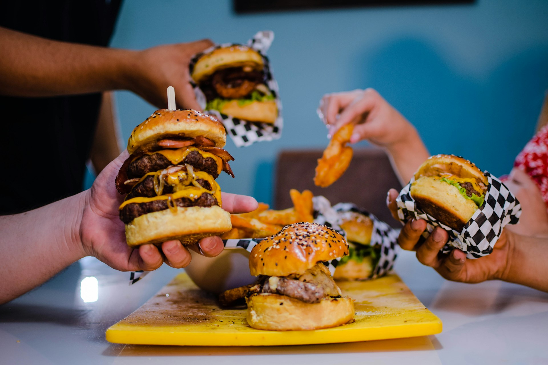 burger with patty and cheese on yellow plate