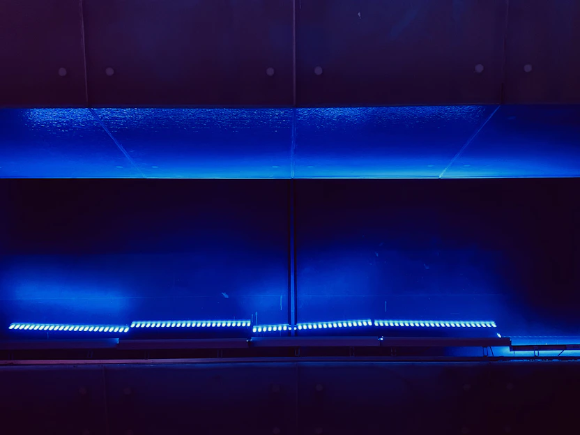 A sleek, futuristic lifestyle product display with cosmic and interstellar design elements glowing softly against a dark space-themed background.