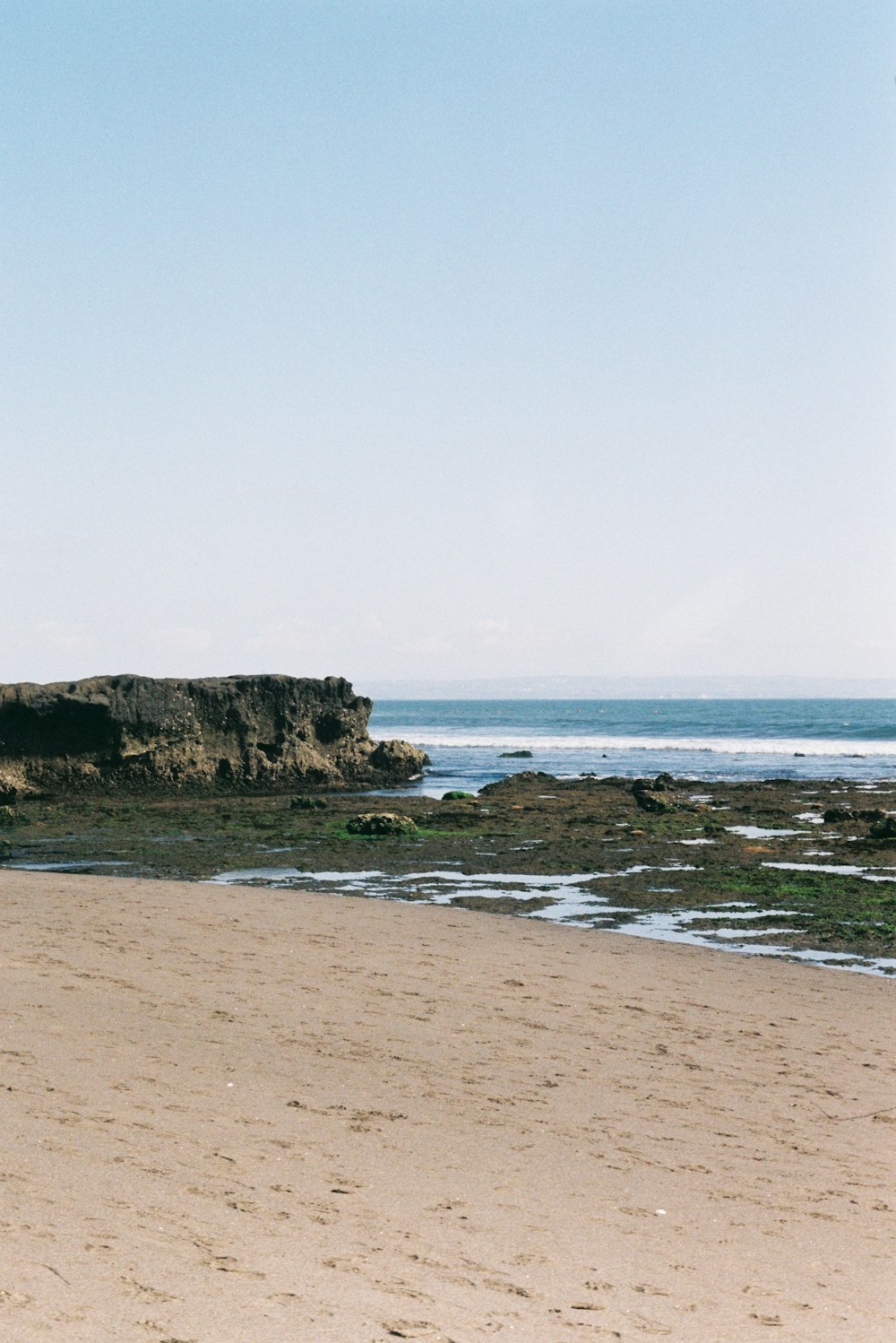 brown rock formation on sea shore during daytime