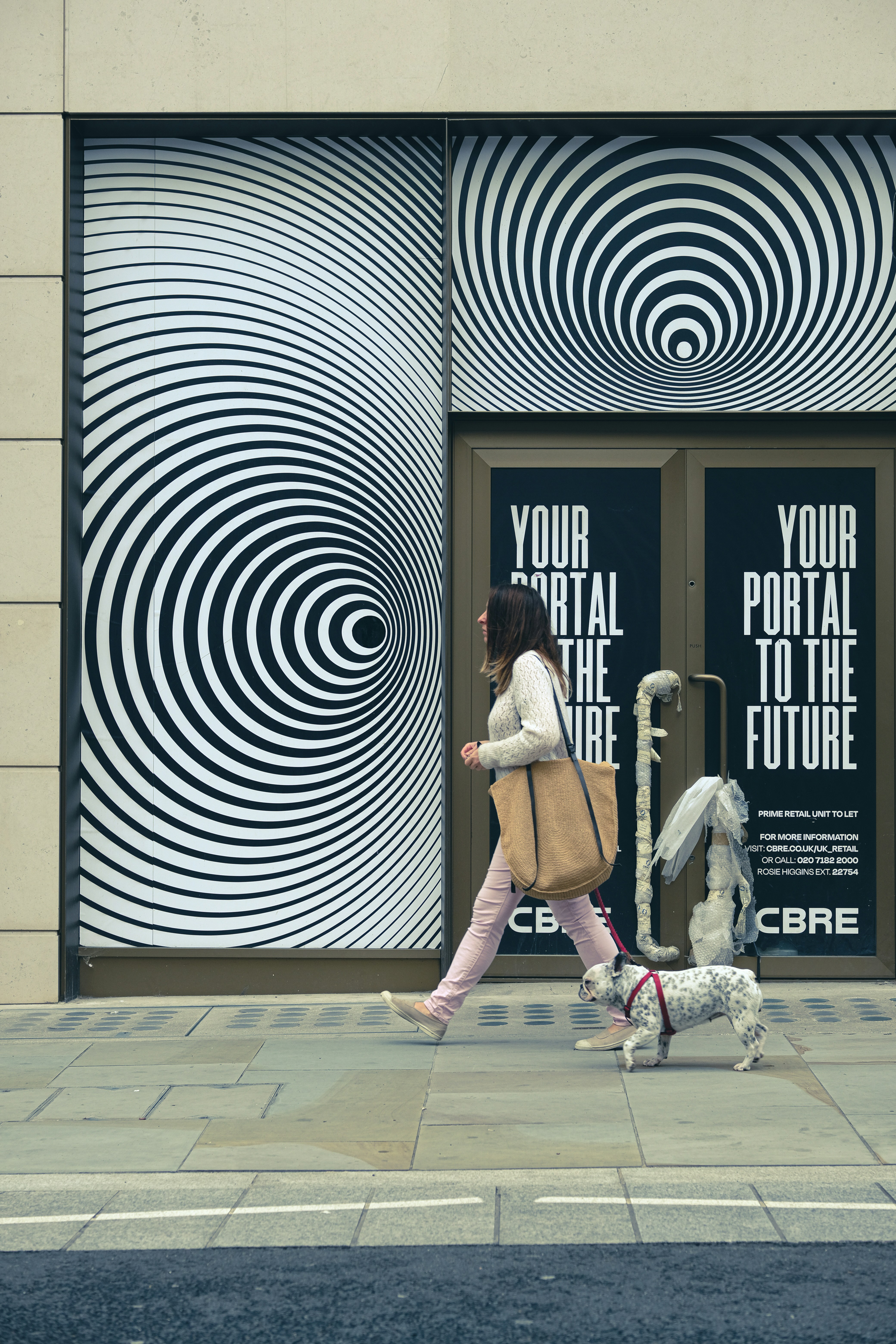 woman in white long sleeve shirt and pink skirt walking on brown wooden floor