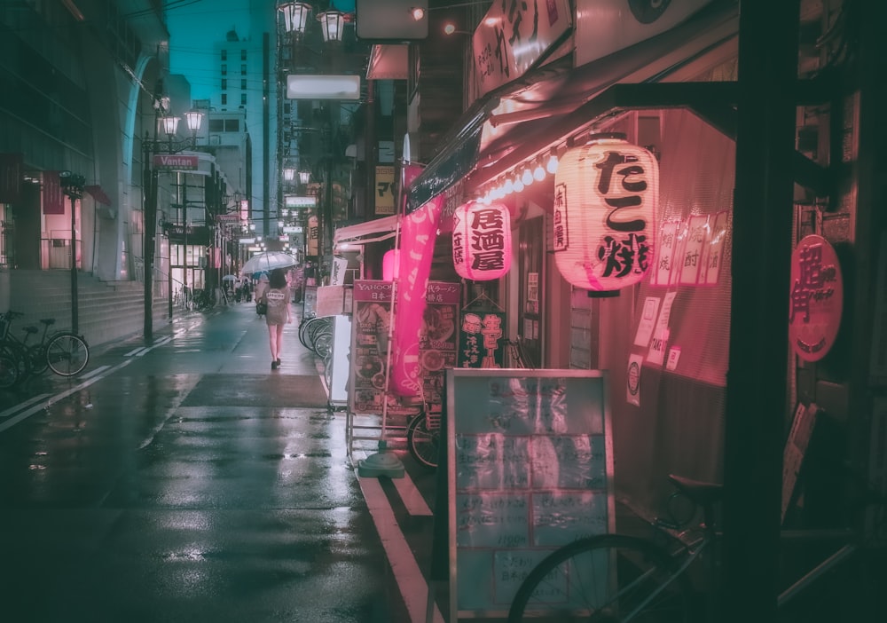 people walking on street during nighttime