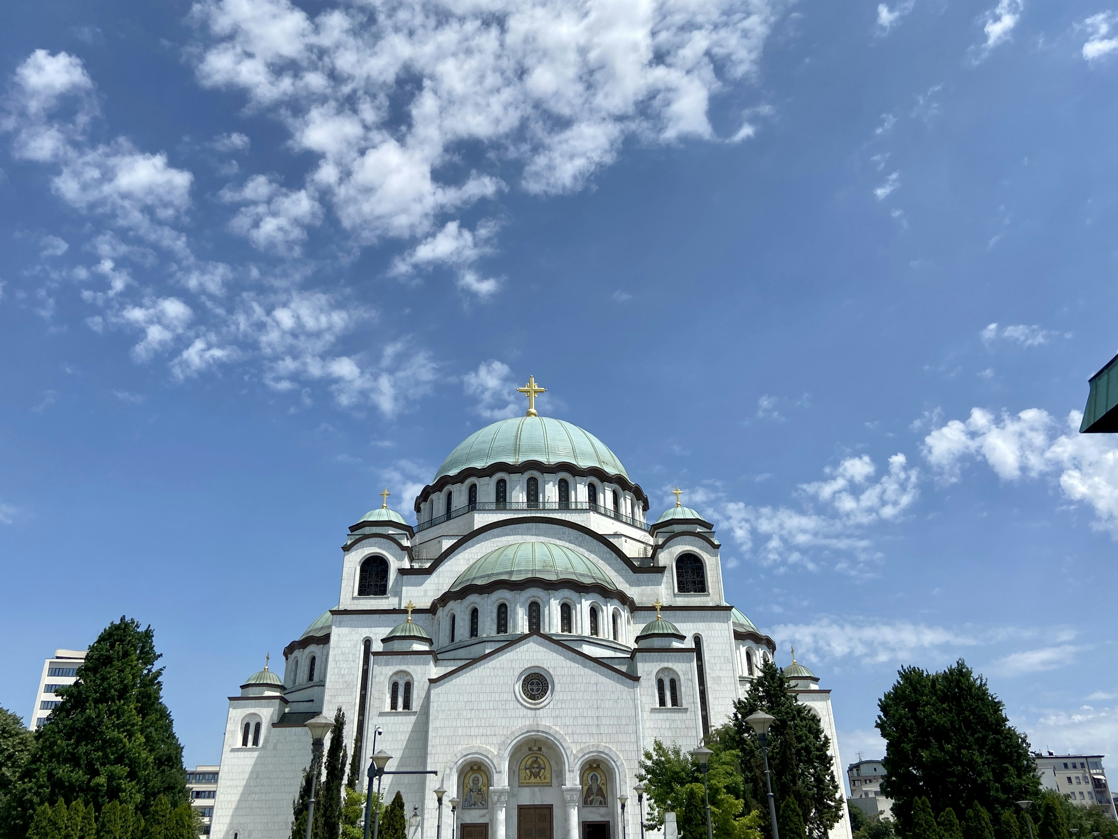 white and green dome building under blue sky during daytime