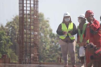 A group of skilled workers in safety gear ready for a construction project