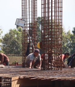 people standing on brown wooden bridge during daytime