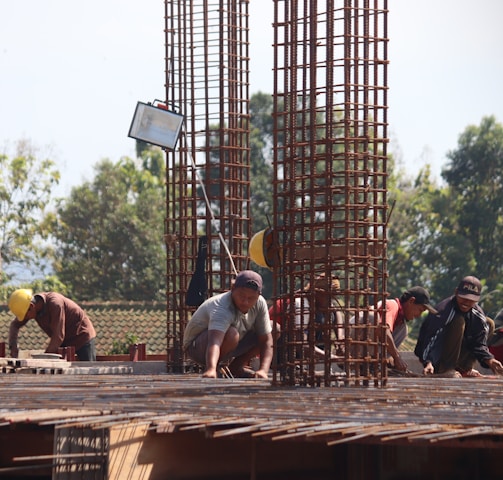 people standing on brown wooden bridge during daytime