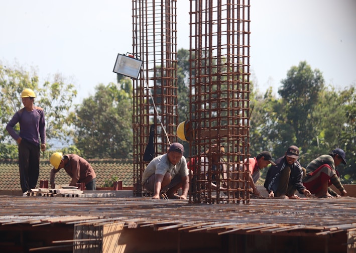 people standing on brown wooden bridge during daytime