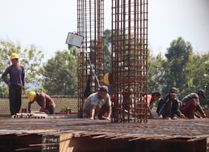 people standing on brown wooden bridge during daytime