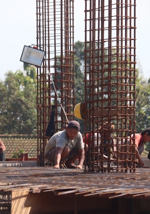 people standing on brown wooden bridge during daytime