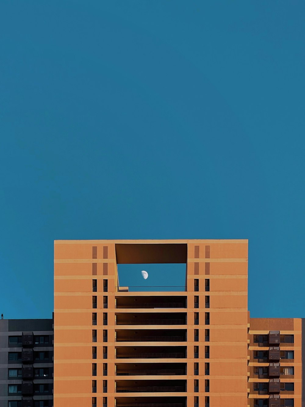 brown concrete building under blue sky during daytime