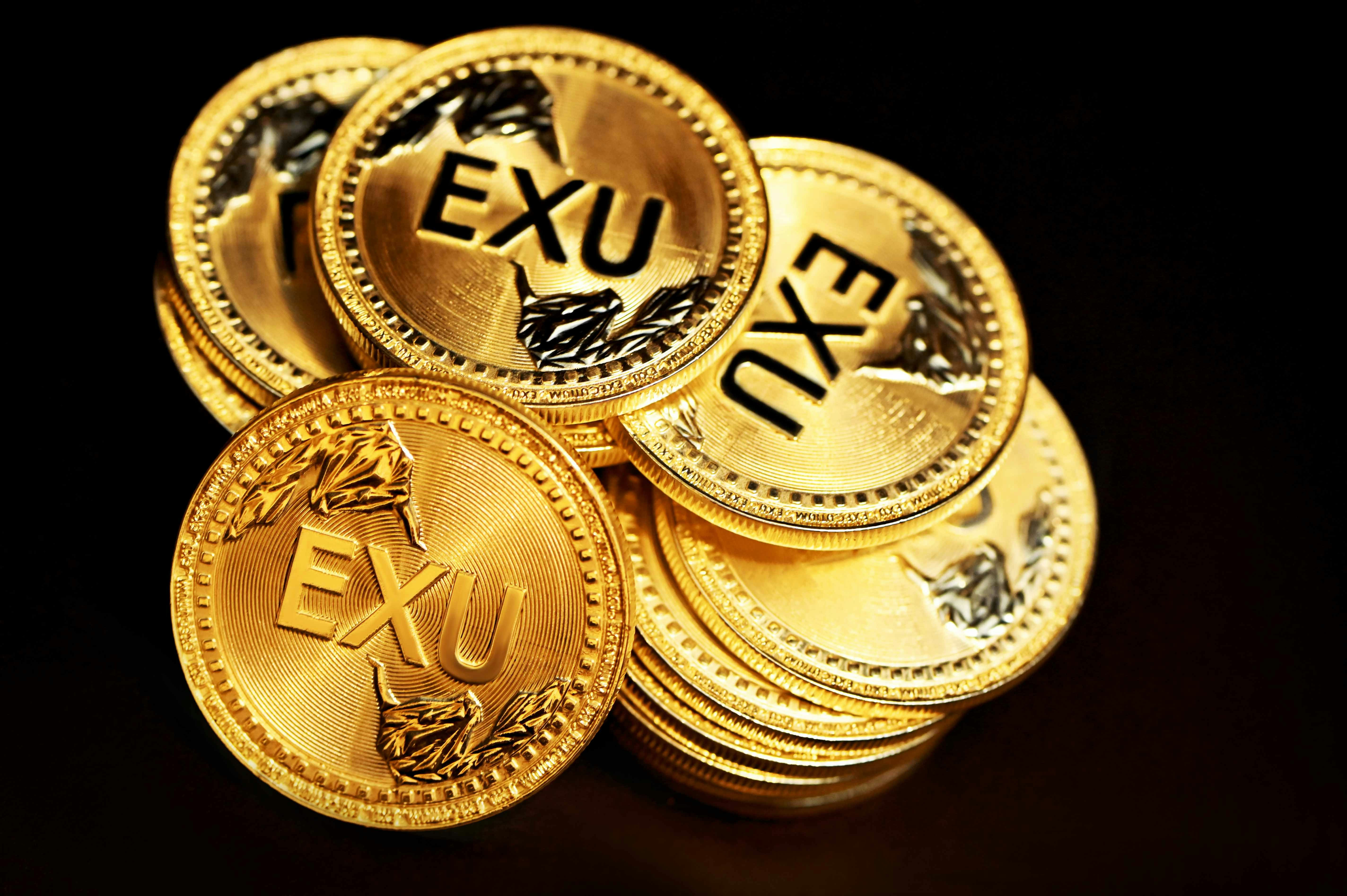 Executium coins in a messy pile