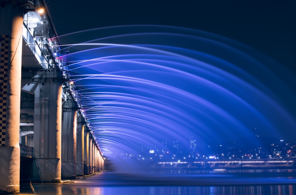 blue lights on bridge during night time