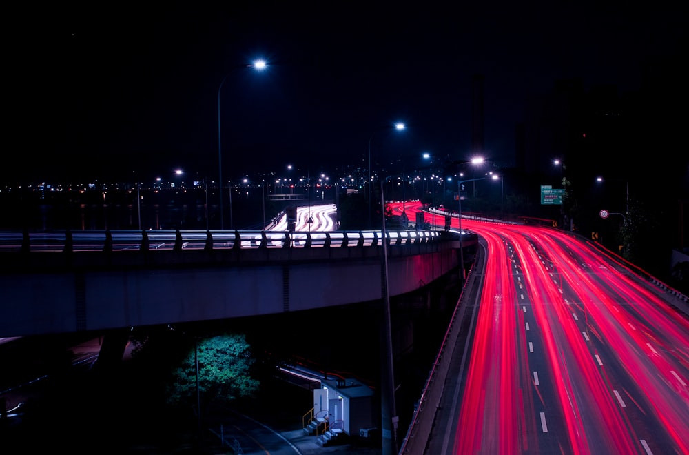 time lapse photography of cars on road during night time