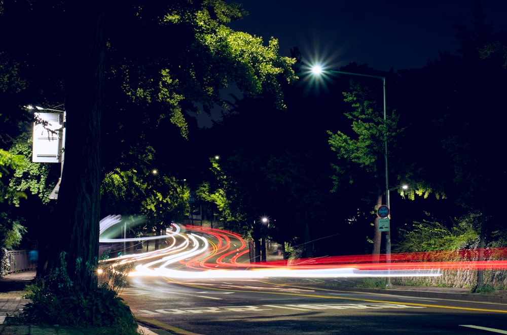 time lapse photography of cars on road during nighttime