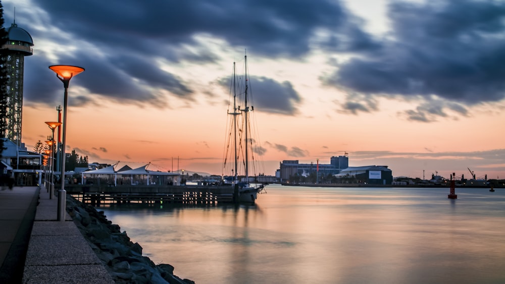 boat on dock during sunset