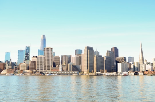city skyline across body of water during daytime