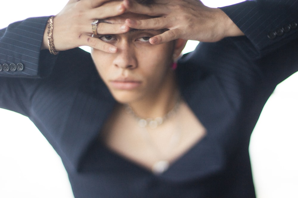 woman in black blazer wearing silver ring