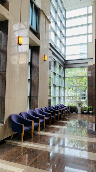 Bright and welcoming hospital lobby with natural light streaming through large windows