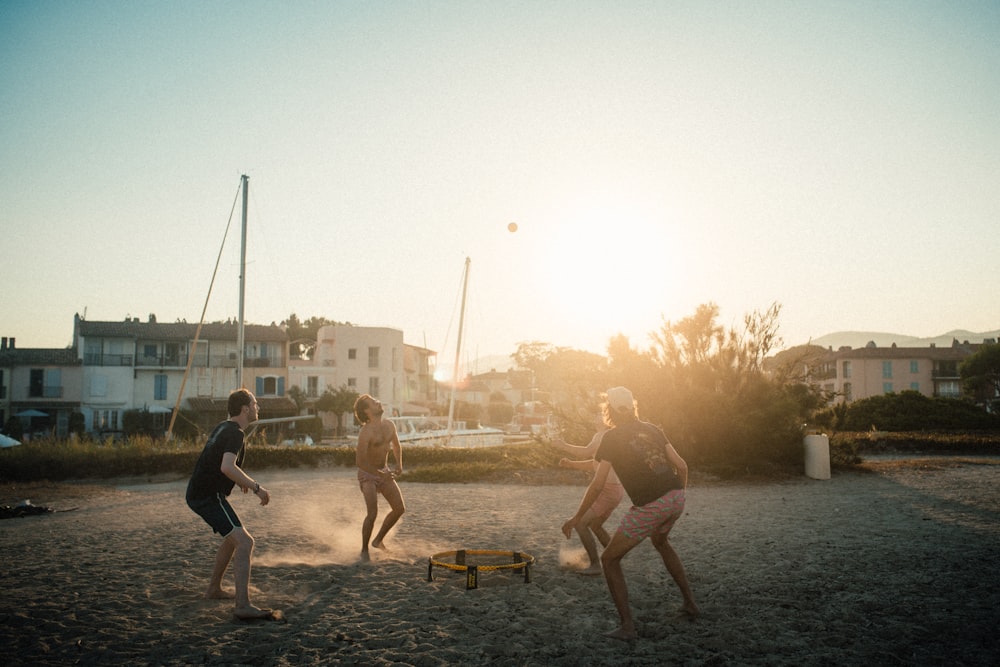 people playing on beach during daytime