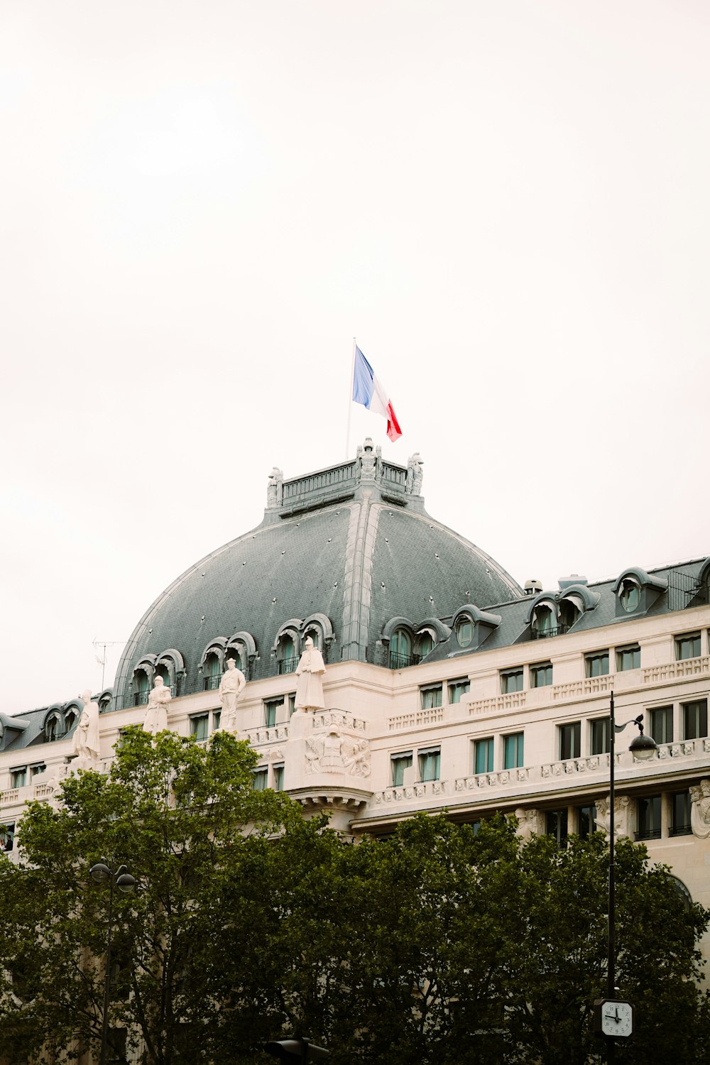 white concrete building with flag of us a during daytime