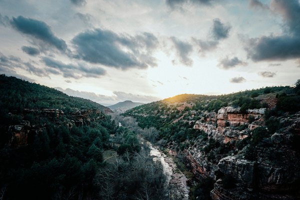Green trees on mountain under cloudy sky during daytime — Sedona, United States