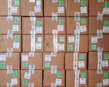 Stack of used truck accessories ready for shipment with labels and packaging