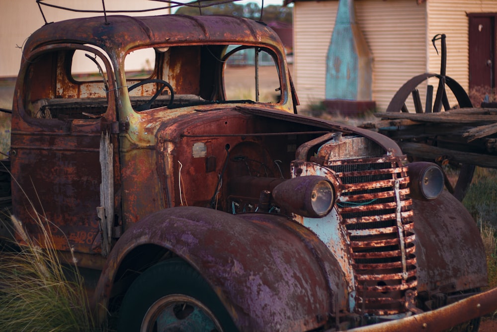 vintage brown car in front of white building