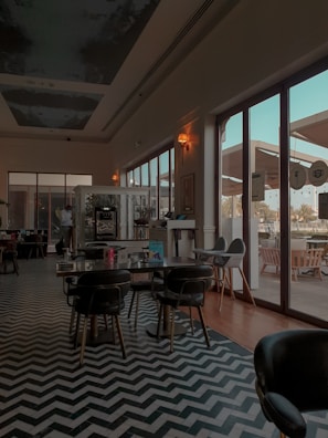 An elegant chevron floor design in a cozy dining area.