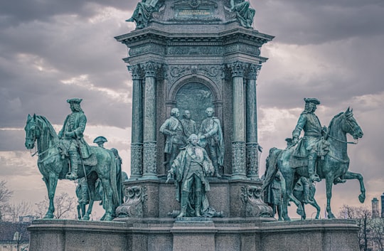 statue of man and woman in Mária Terézia tér Austria