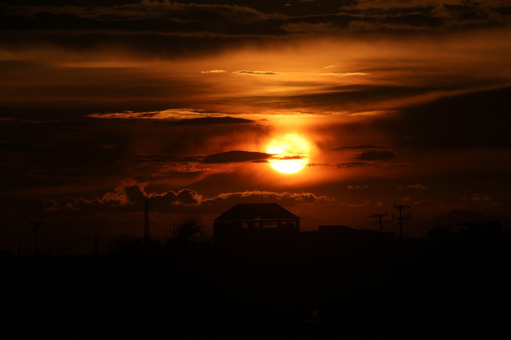 silhouette of building during sunset