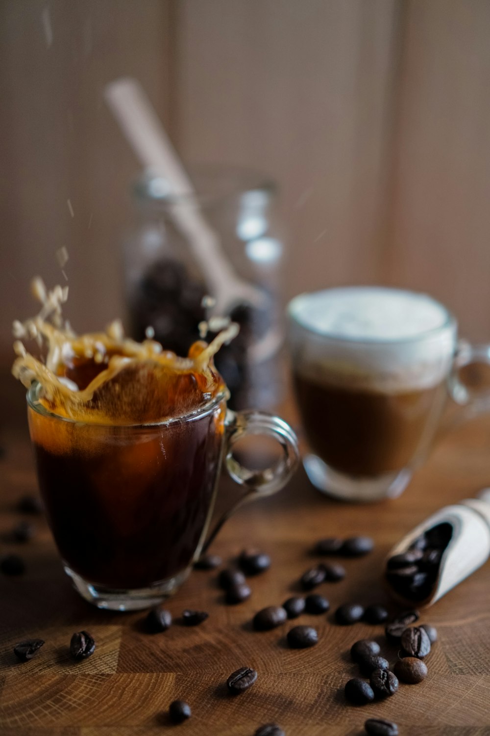 clear glass mug with brown liquid