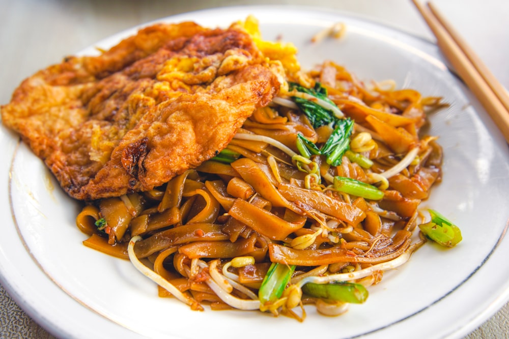 pasta with sauce on white ceramic plate