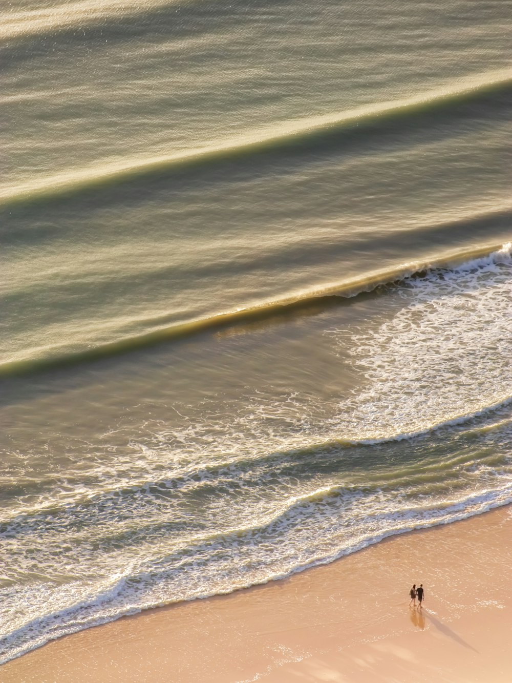 person walking on beach during daytime