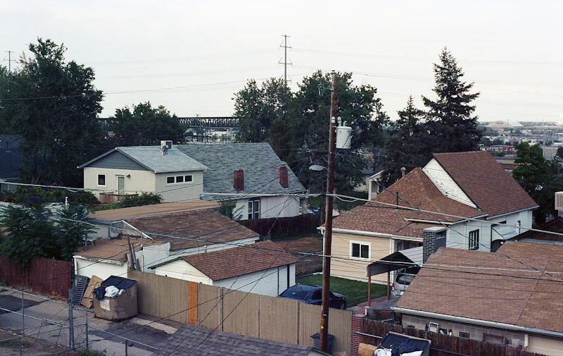 Row of attached townhomes in brick and white